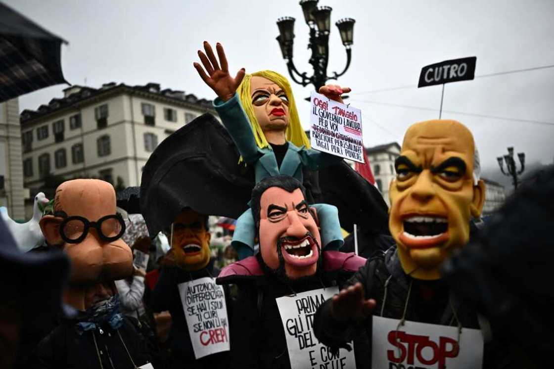 Demonstrators with a puppet of Italy's Prime Minister Giorgia Meloni, centre, at a May Day rally in Turin Demonstrators with a puppet of Italy's Prime Minister Giorgia Meloni, centre, at a May Day rally in Turin