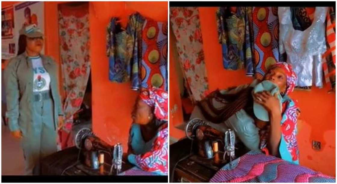 Nigerian lady in NYSC uniform saluting her mother in her shop.