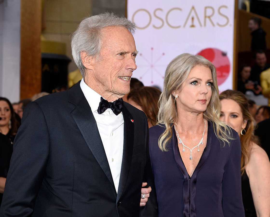 Clint Eastwood and Christina Sandera attend an award ceremony