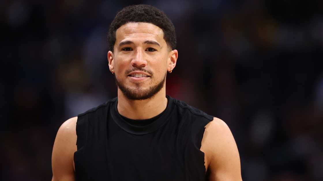 Devin Booker of the Phoenix Suns looks on before a 2025 game against the Denver Nuggets Devin Booker of the Phoenix Suns looks on before a 2025 game against the Denver Nuggets
