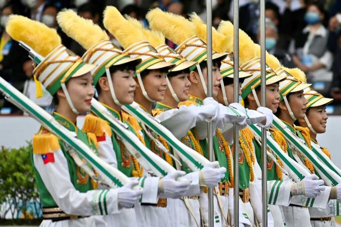 Students perform during celebrations to mark the island's National Day in front of the Presidential Office in Taipei on October 10, 2022.