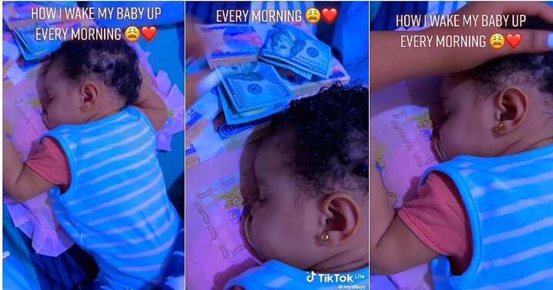 Mum wakes baby with money, bundles of cash