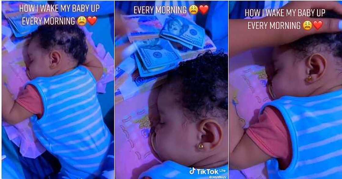 Mum wakes baby with money, bundles of cash Mum wakes baby with money, bundles of cash