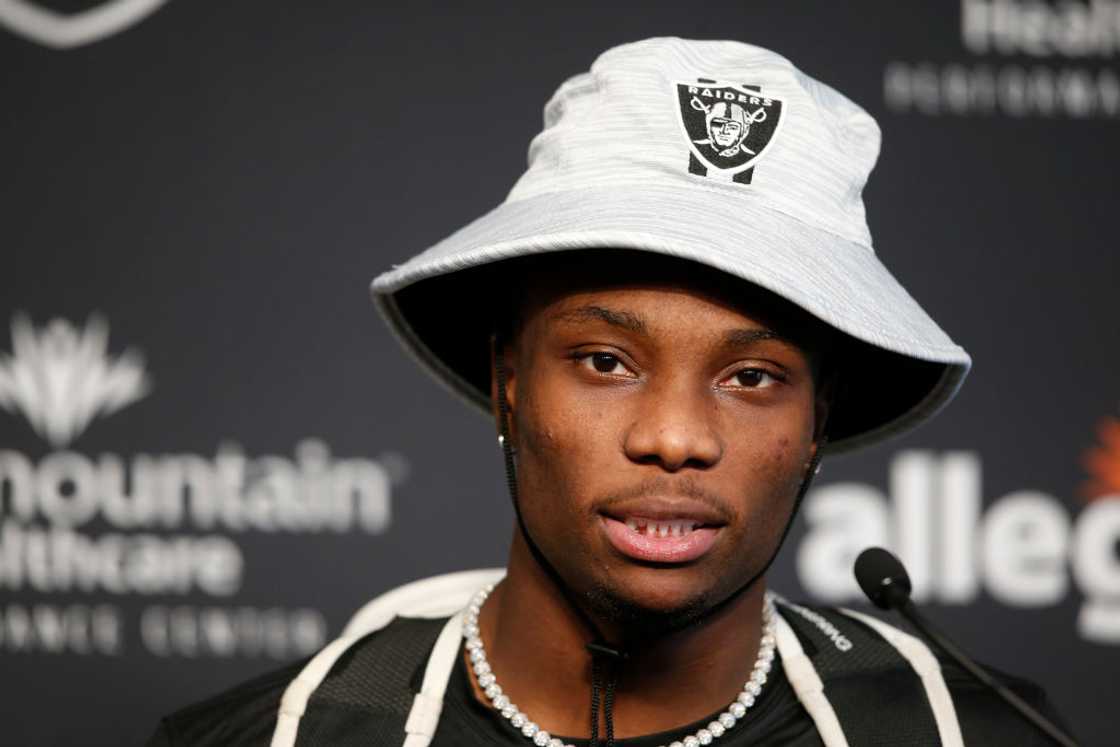 Henry Ruggs III speaks with reporters