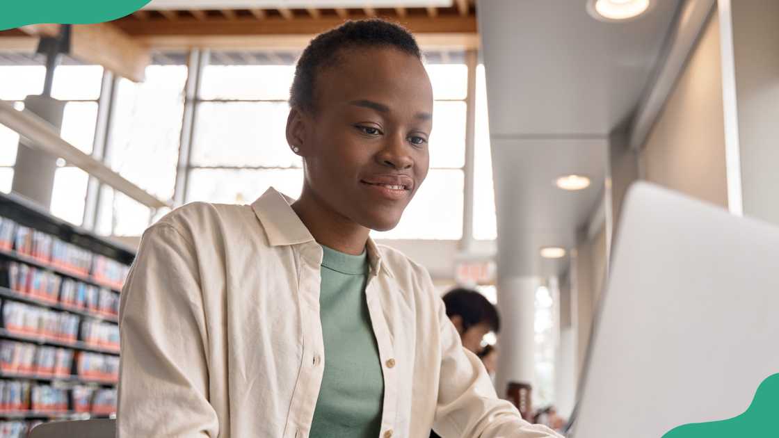 A female student studies in a library A female student studies in a library