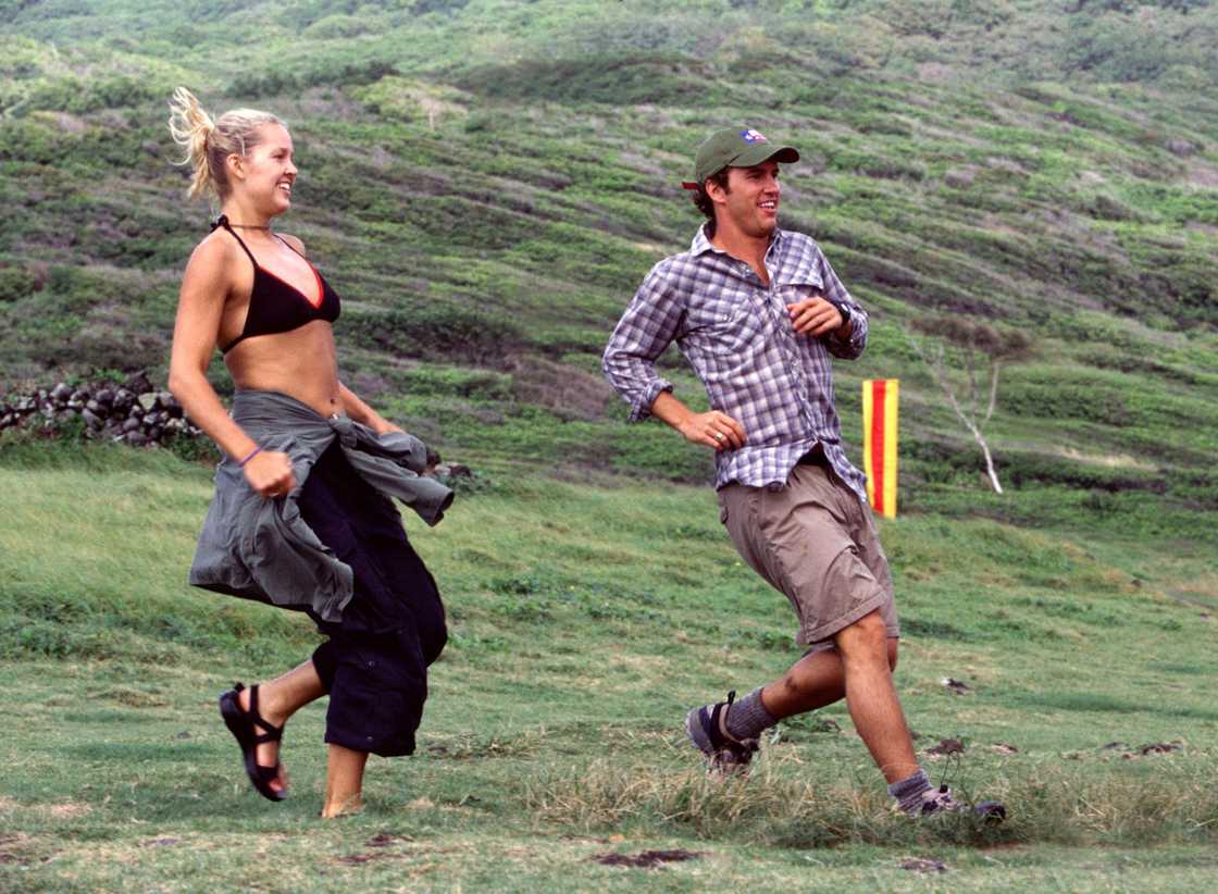 Paige and Blake Mycoskie run down the hill in The Amazing Race 2 Paige and Blake Mycoskie run down the hill in The Amazing Race 2
