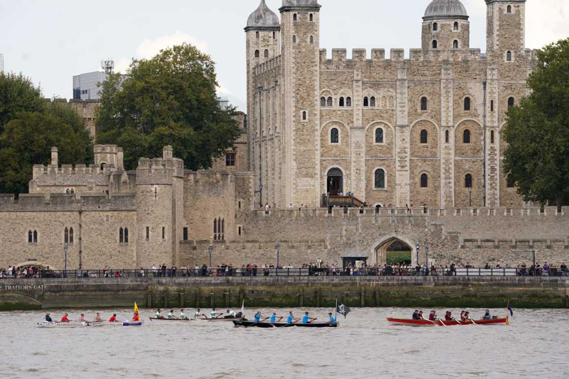 Boats passing the Tower of London in central London Boats passing the Tower of London in central London