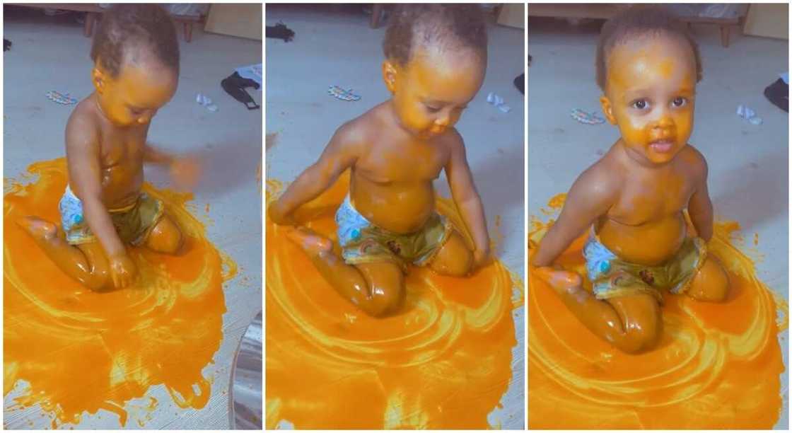 Black baby boy sitting playfully on spilled palm oil that costs 10$ or about N4,000. Black baby boy sitting playfully on spilled palm oil that costs 10$ or about N4,000.