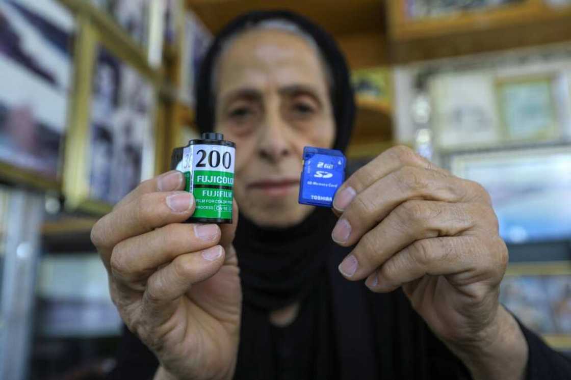 Samira Mazaal shows a film roll and a digital memory card: now aged 77, she has been working as a photographer since she was 16 Samira Mazaal shows a film roll and a digital memory card: now aged 77, she has been working as a photographer since she was 16