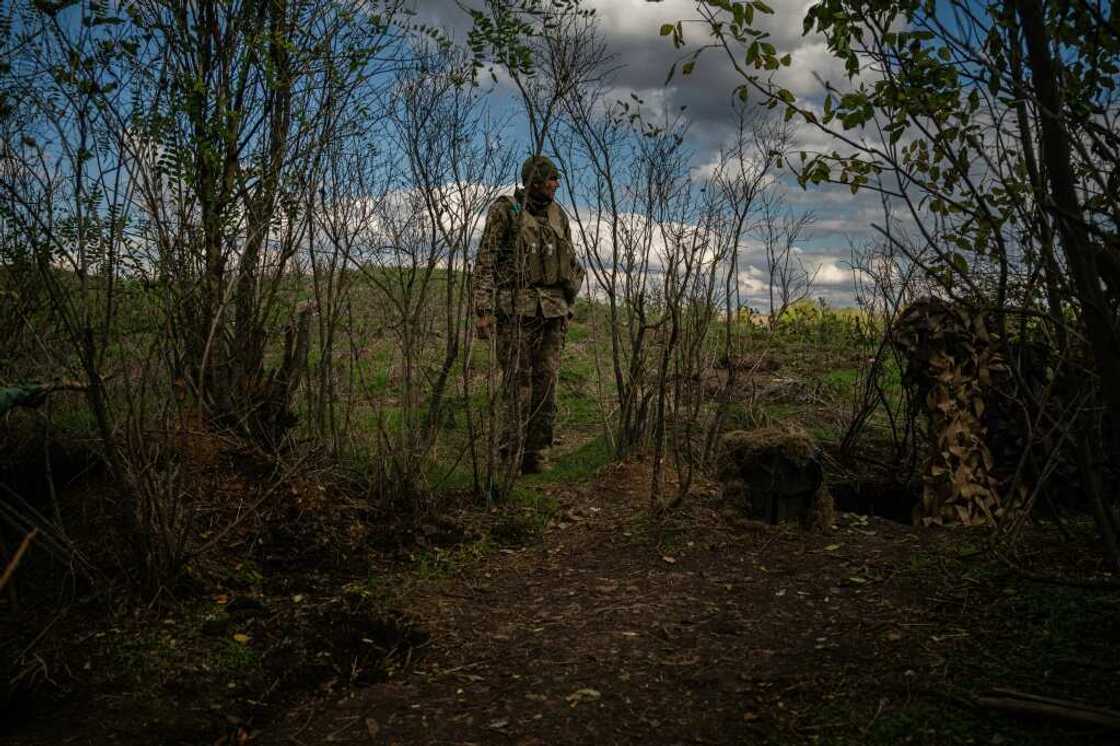 A Ukrainian soldier stands at a position along the front line in the southern Mykolaiv region