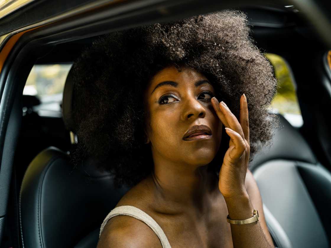 A woman inside her car