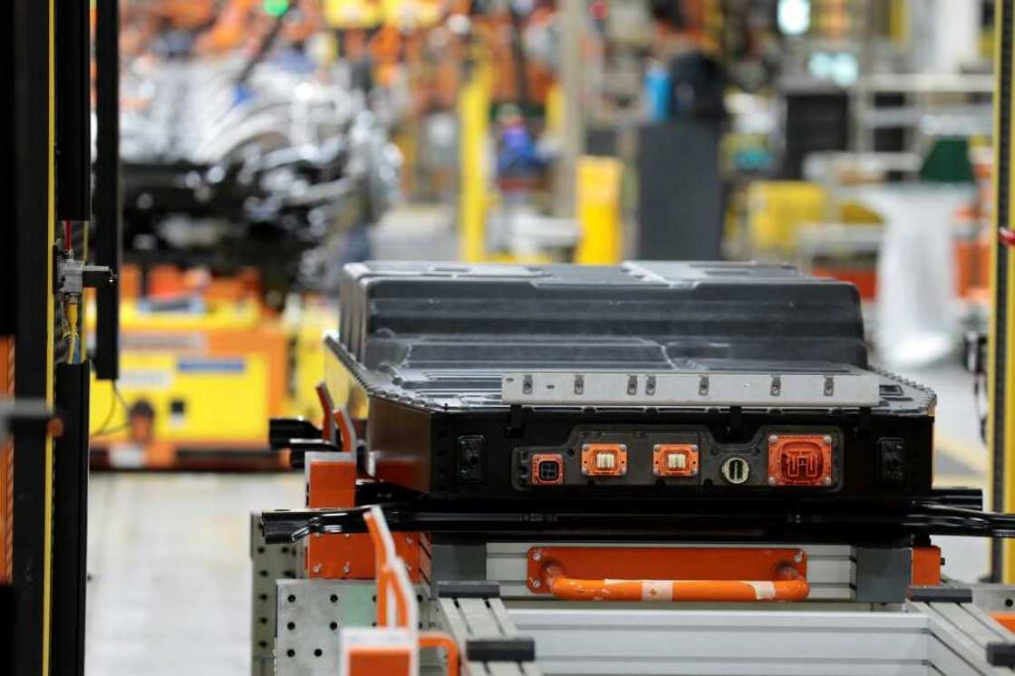 A battery waits to be installed on the frame of an electric-powered F-150 Lightning truck A battery waits to be installed on the frame of an electric-powered F-150 Lightning truck