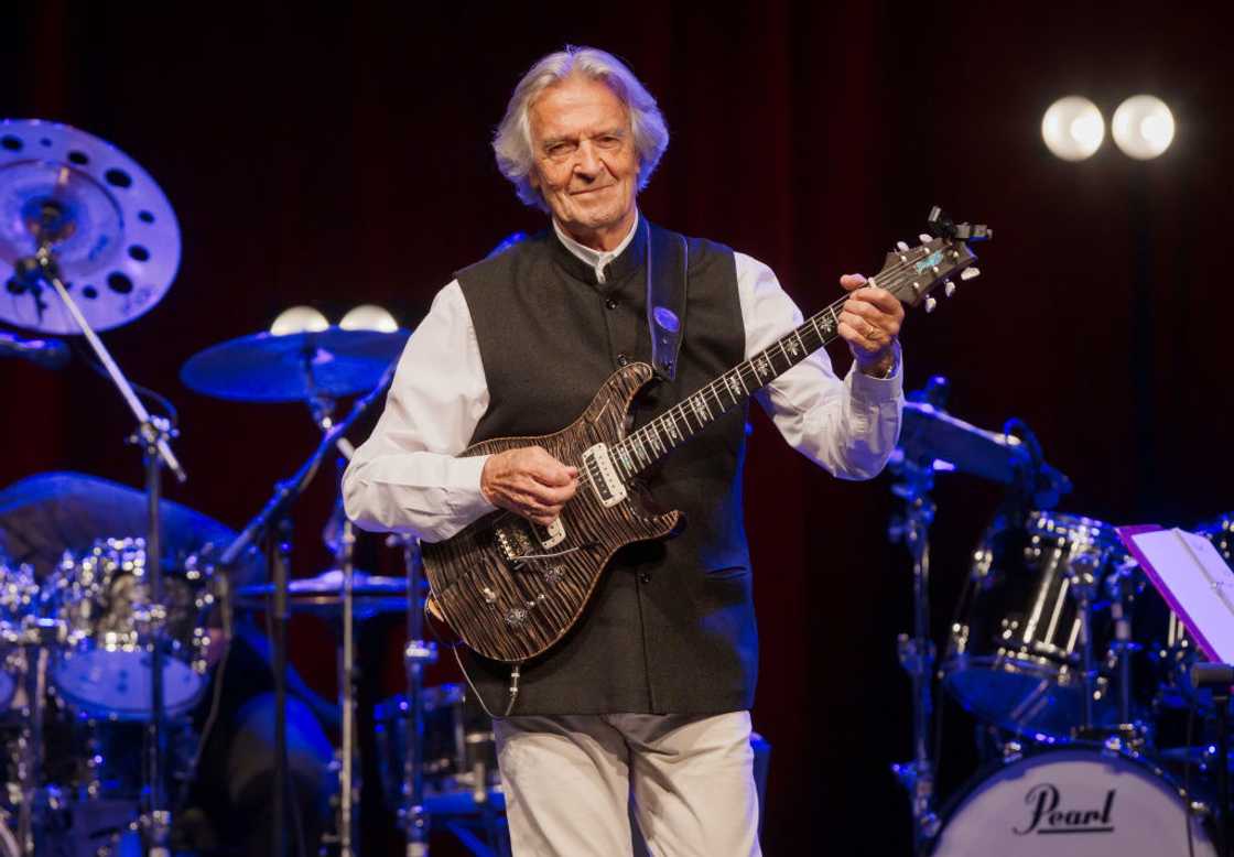 British guitarist John McLaughlin performs live on stage during a concert at the Admiralspalast