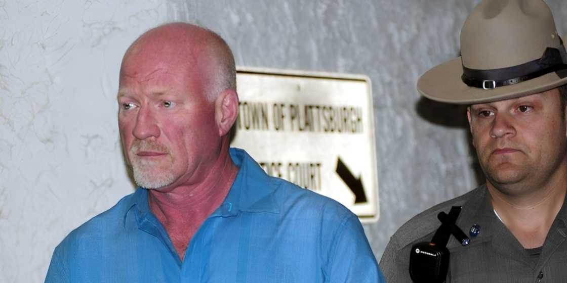 Gene Palmer is pictured in handcuffs leaving a court session. Gene Palmer is pictured in handcuffs leaving a court session.