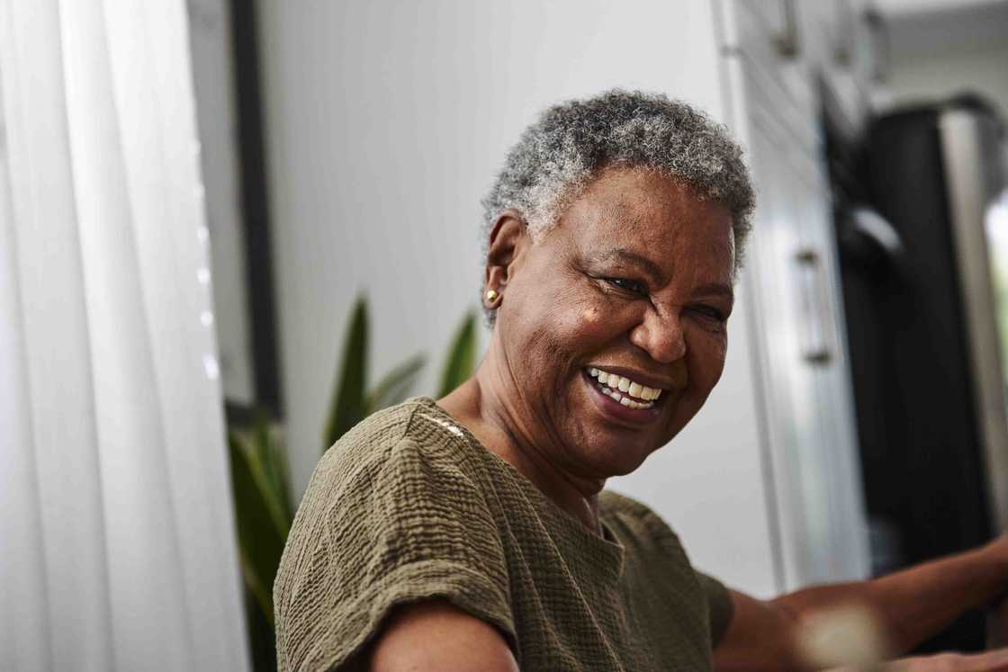 A woman talking with someone at home