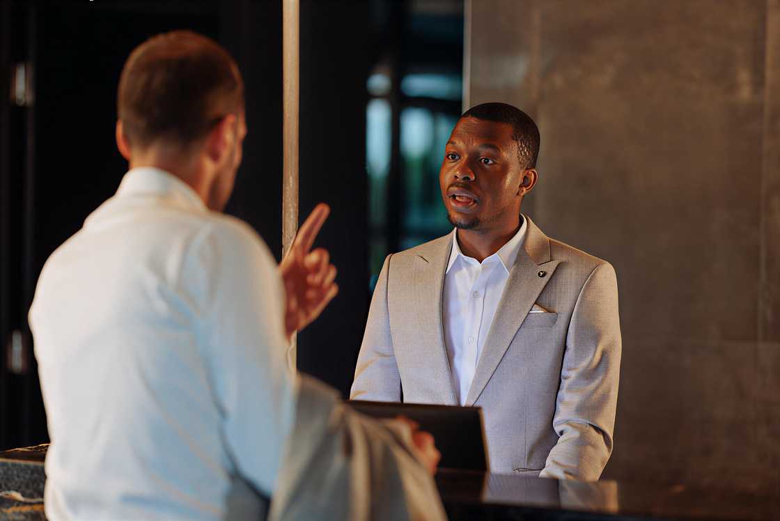 An angry hotel guest is complaining An angry hotel guest is complaining