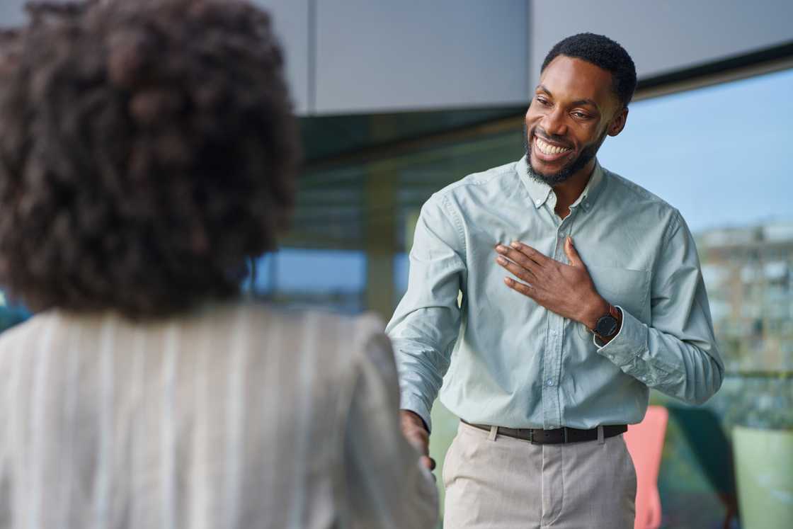 Businessman shaking hands with a colleague Businessman shaking hands with a colleague