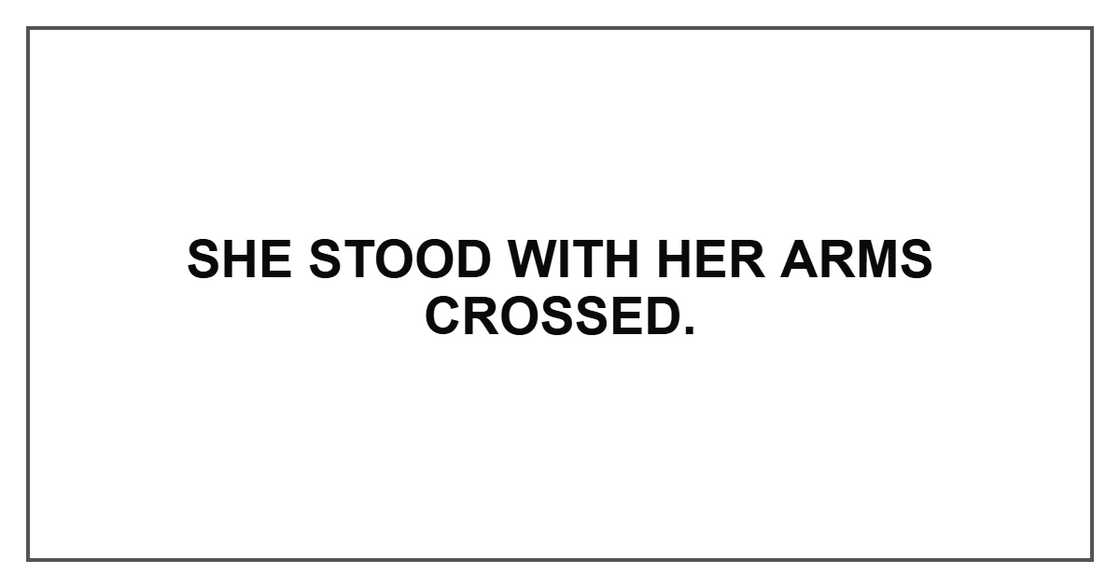 She stood with her arms crossed.