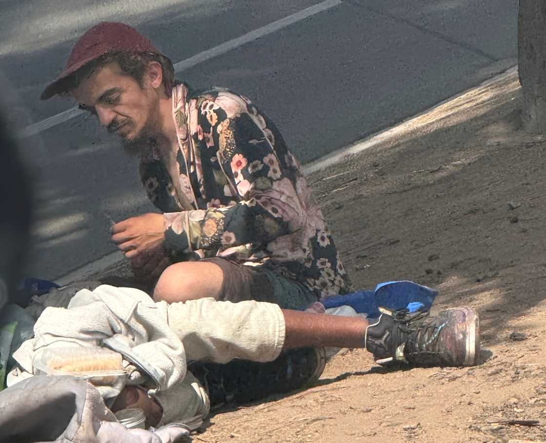 Tylor Chase sits on the streets Tylor Chase sits on the streets