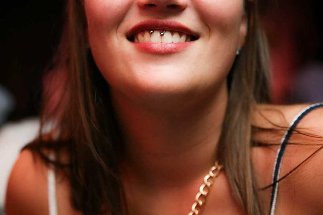 A woman with smiley piercing A woman with smiley piercing