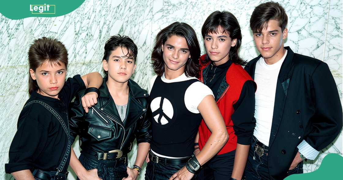 Menudo band members pose together