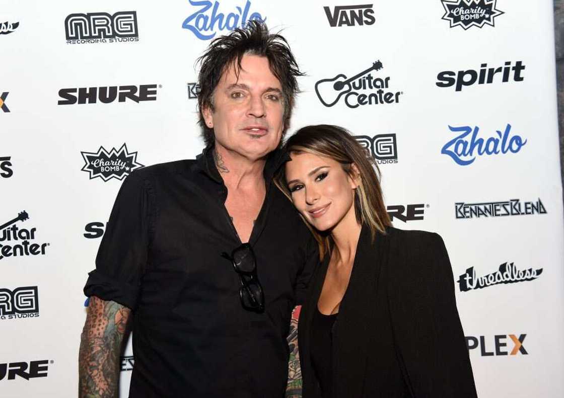 Musician Tommy Lee of Motley Crue (L) and Brittany Furlan (R) posing for a photo