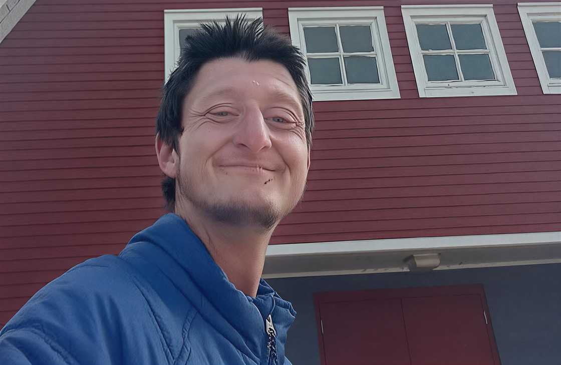 Daniel Larson outside a house