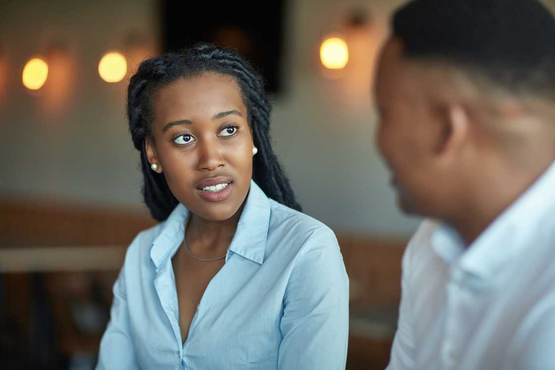 Male and female professionals discussing business Male and female professionals discussing business