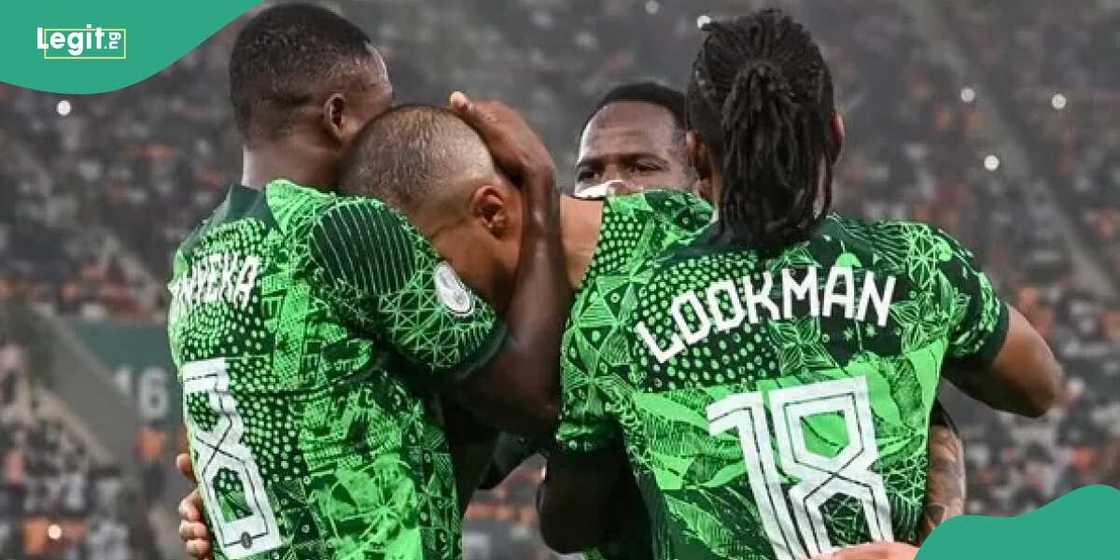 Onyeka hugs Ekong after he successfully converted a penalty against South Africa