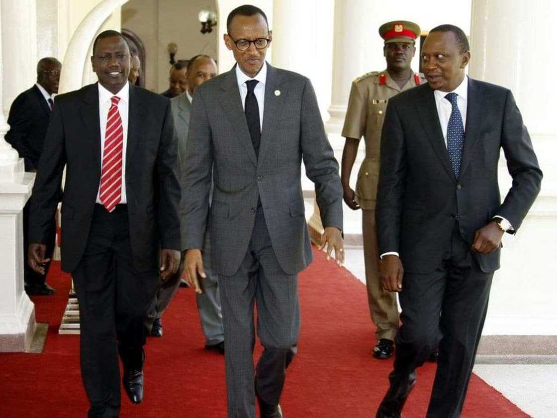 President Paul Kagame emerges the shortest member of his family while posing in daughter's wedding photo