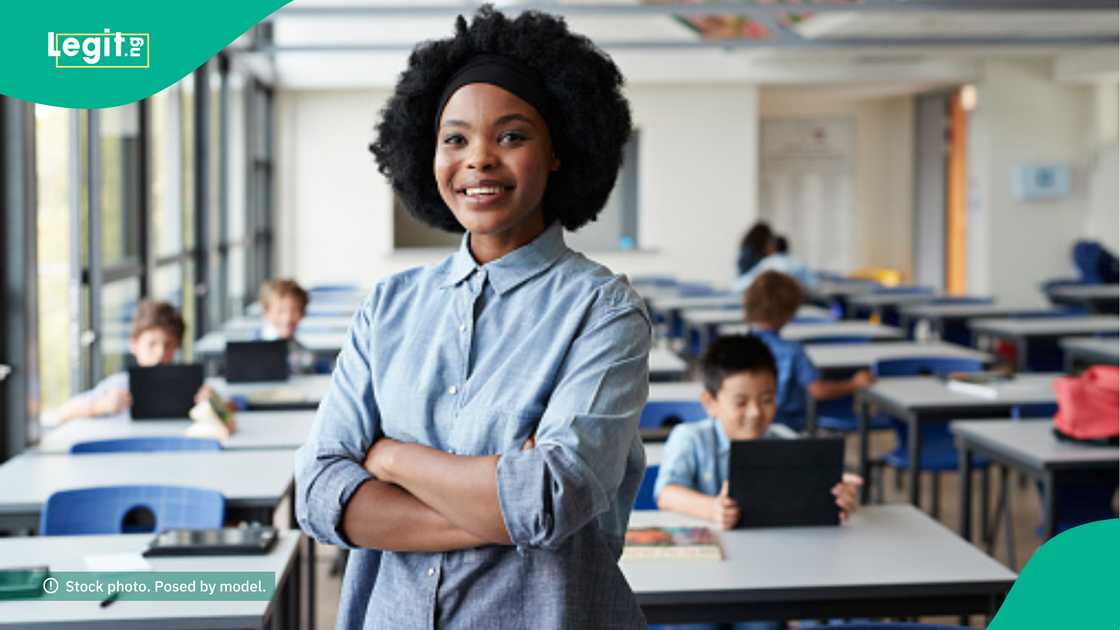 Female teacher displays message she saw on her student's script while marking Female teacher displays message she saw on her student's script while marking