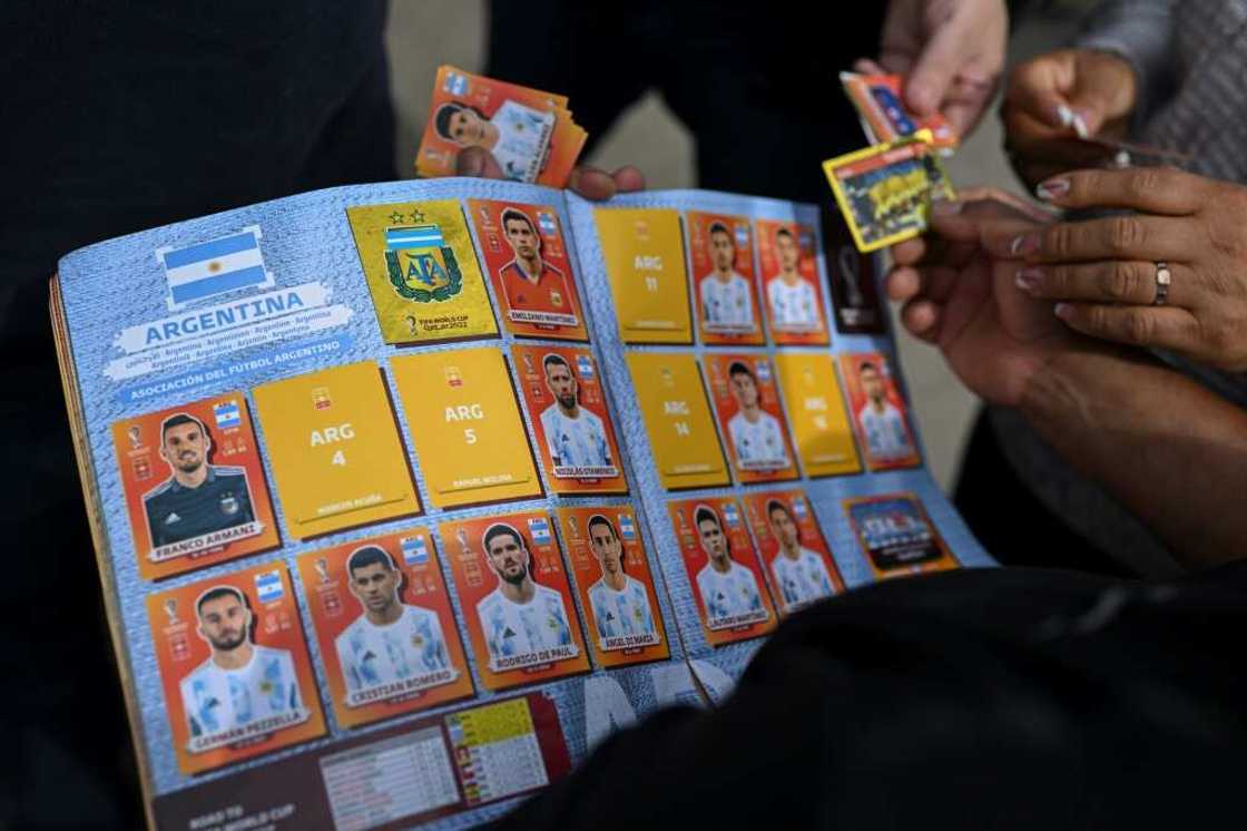 A man exchanges Panini World Cup football stickers at Rivadivia park in Buenos Aires A man exchanges Panini World Cup football stickers at Rivadivia park in Buenos Aires