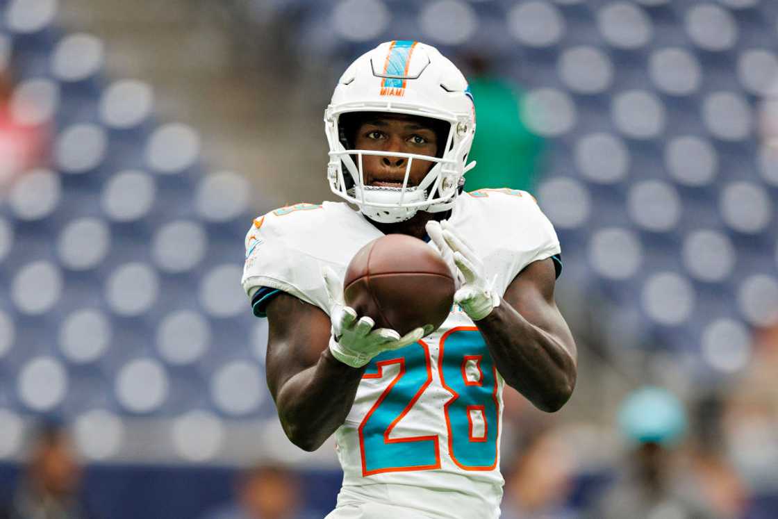 De'Von Achane warms up before the preseason game against the Houston Texans