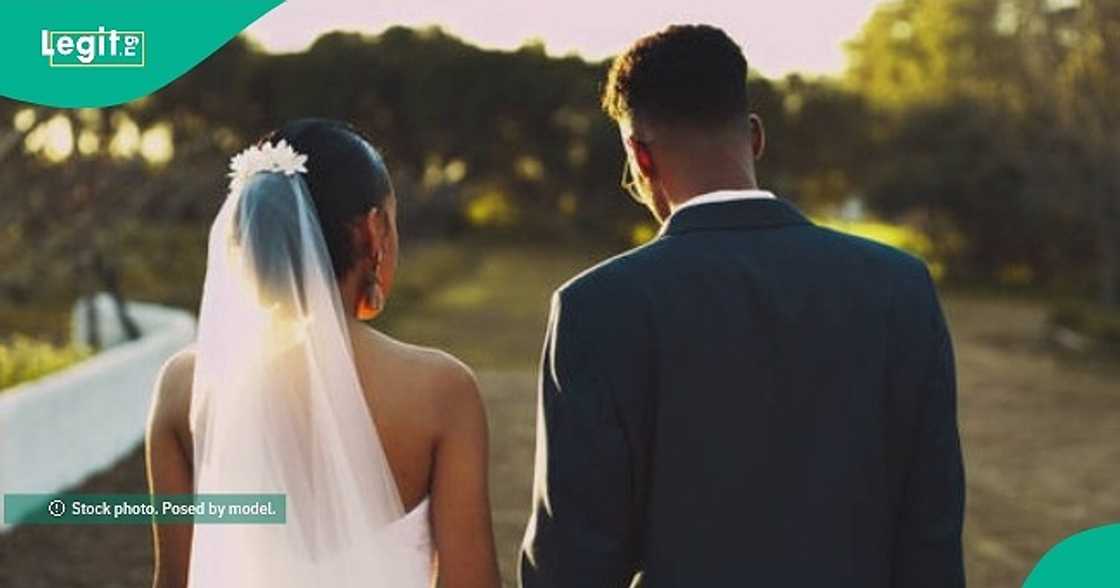 Bride walks down aisle with her late mother's photo engraved on her wedding veil. Bride walks down aisle with her late mother's photo engraved on her wedding veil.