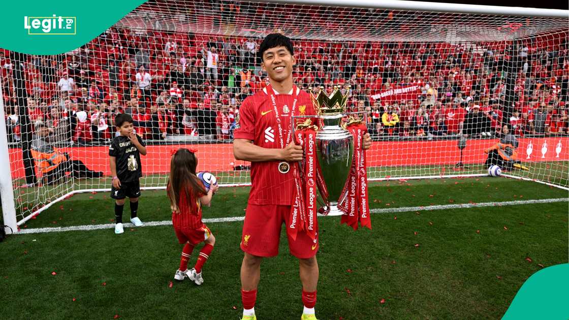 Wataru Endo poses with the Premier League trophy at Anfield. Photo by Liverpool FC Wataru Endo poses with the Premier League trophy at Anfield. Photo by Liverpool FC