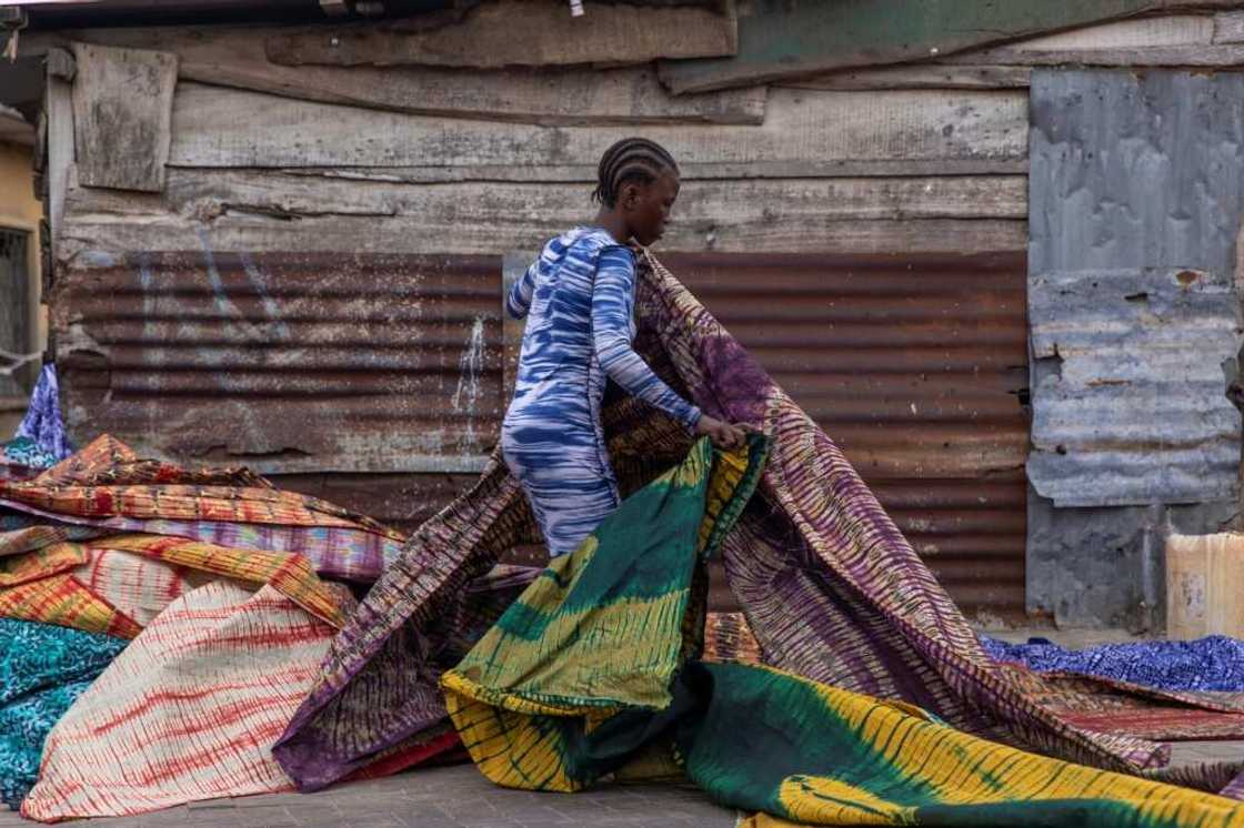 Adire is a popular tie-dye fabric typically used for traditional outfits worn on special occasions in Nigeria Adire is a popular tie-dye fabric typically used for traditional outfits worn on special occasions in Nigeria