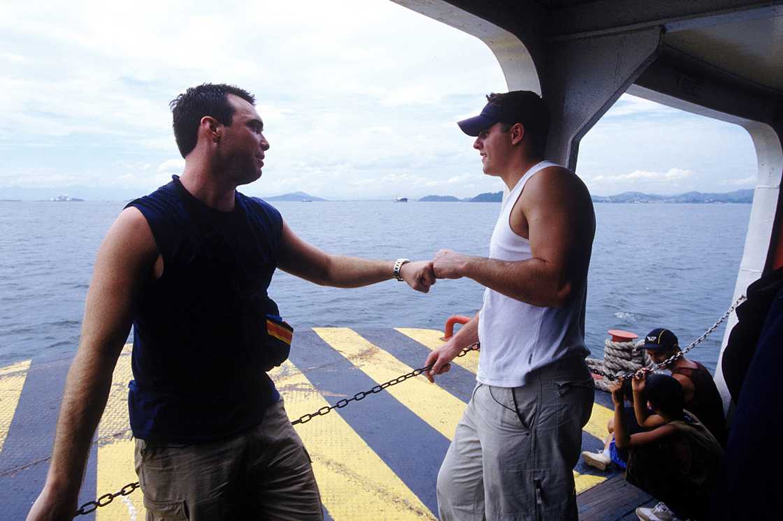 Alex Boylan and Chris Luca take a brief respite on a boat