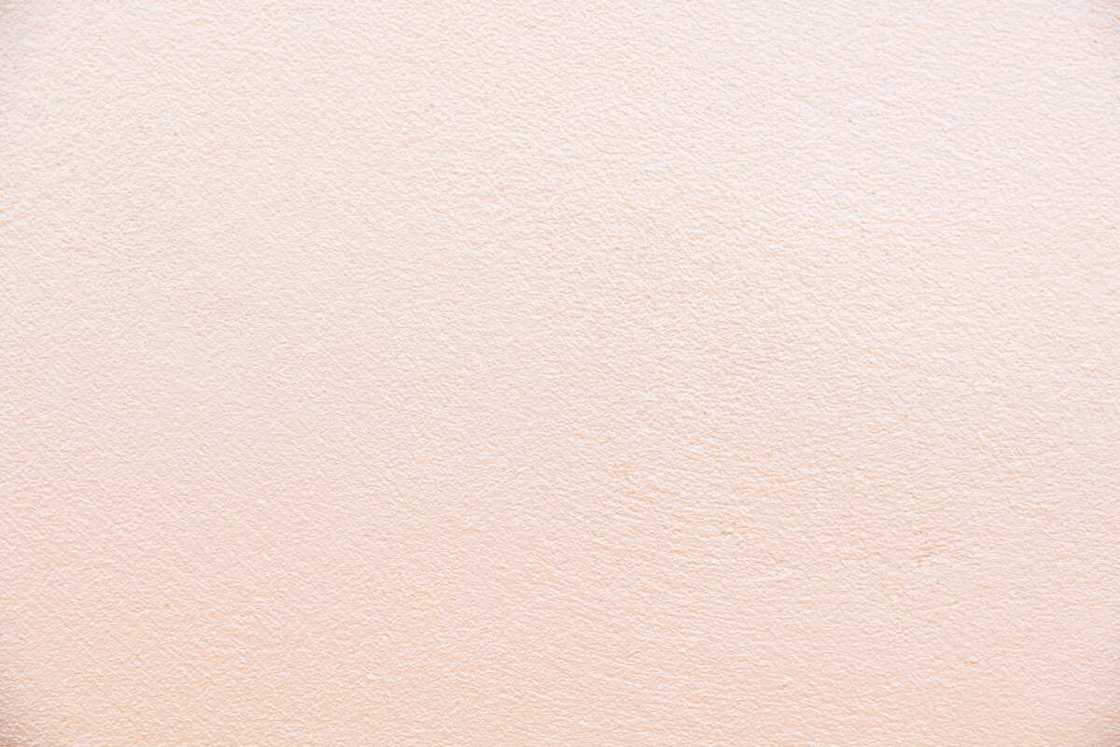 A wall with a cream color