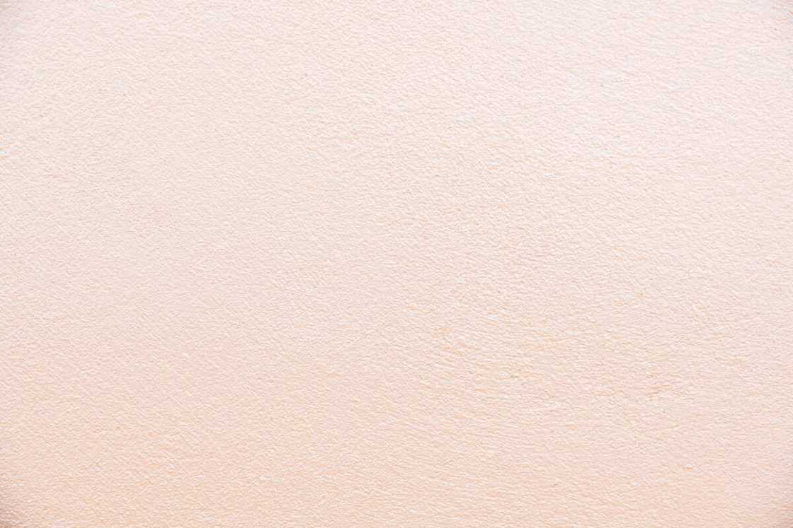 A wall with a cream color A wall with a cream color