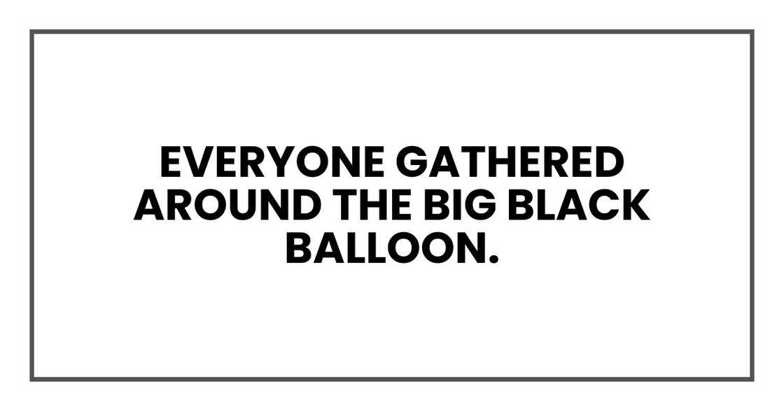 Everyone gathered around the big black balloon. Everyone gathered around the big black balloon.
