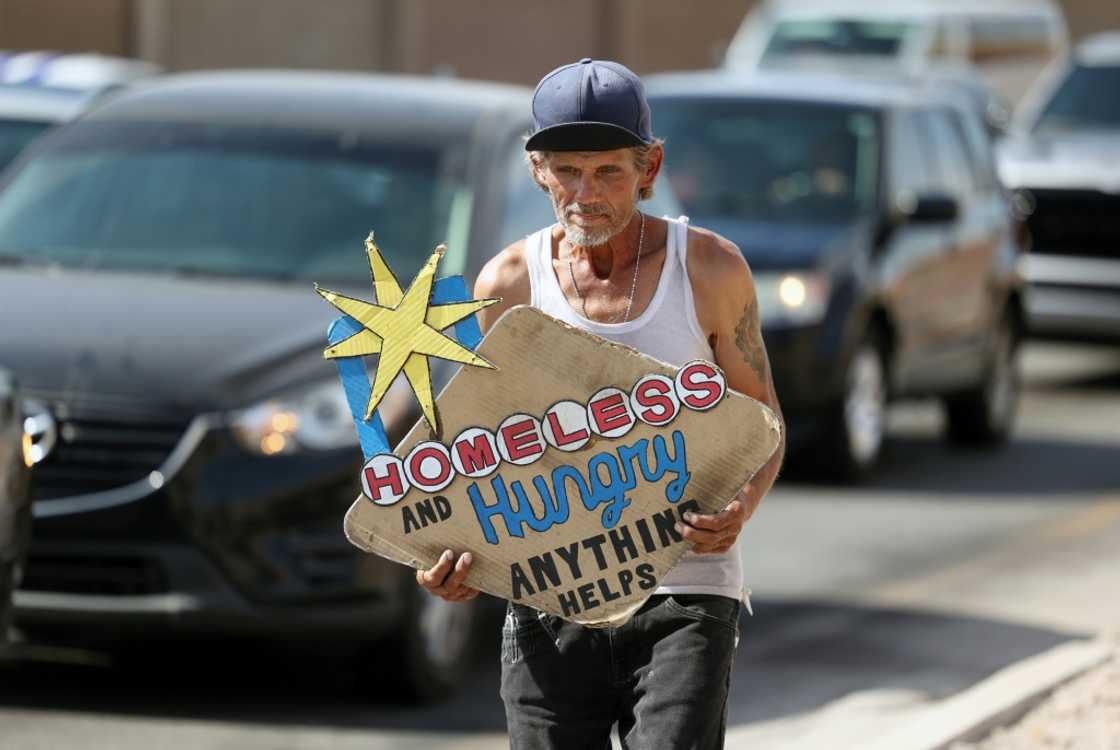 Sam Mitchell, an electrician who lost his job four years ago, panhandles at traffic lights Sam Mitchell, an electrician who lost his job four years ago, panhandles at traffic lights