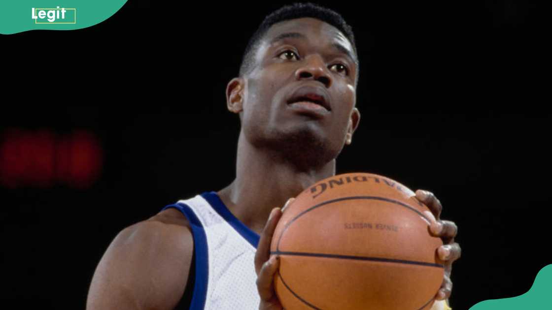 Dikembe Mutombo prepares to make a free throw during the NBA Midwest Division basketball game