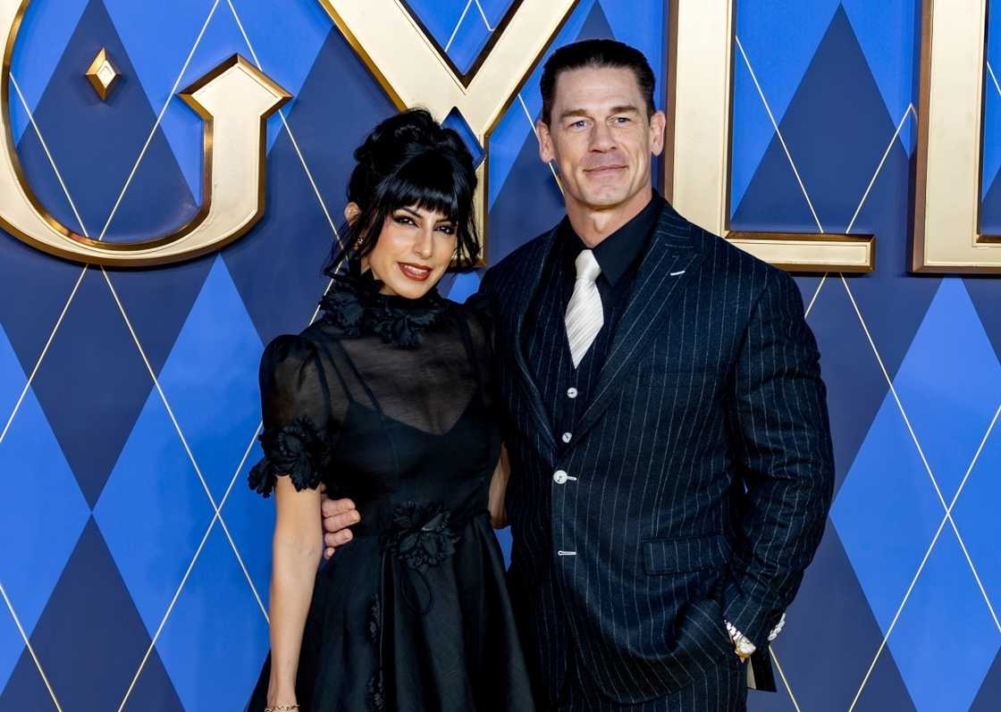 John Cena and Shay Shariatzadeh pose on the red carpet of the premiere of Argylle
