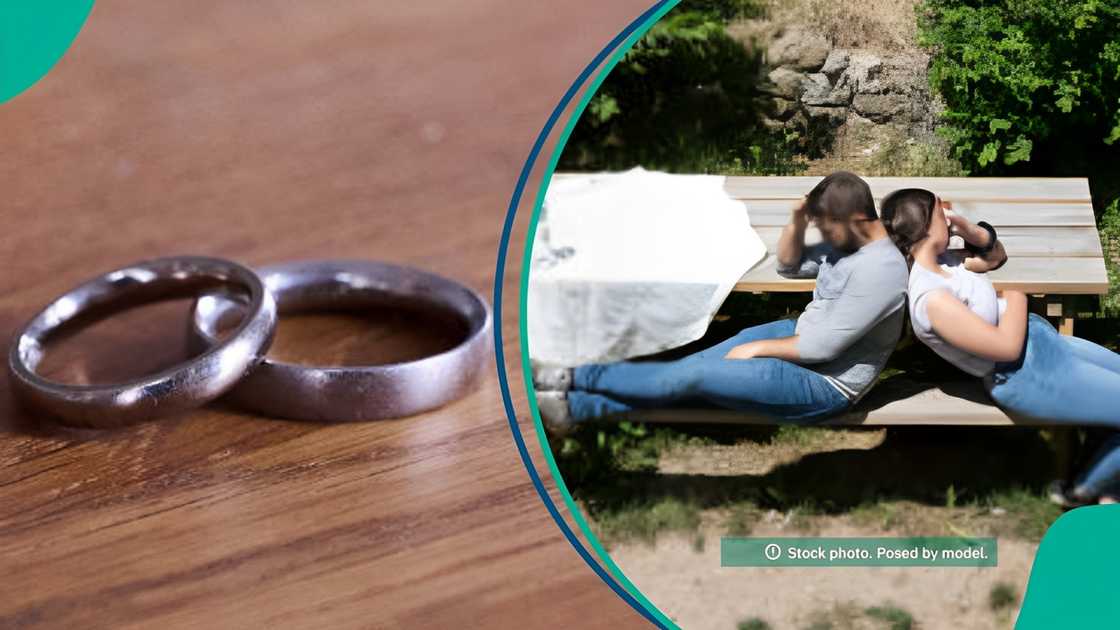 An estranged couple, pair of wedding rings lying on a table, representing a broken marriage.