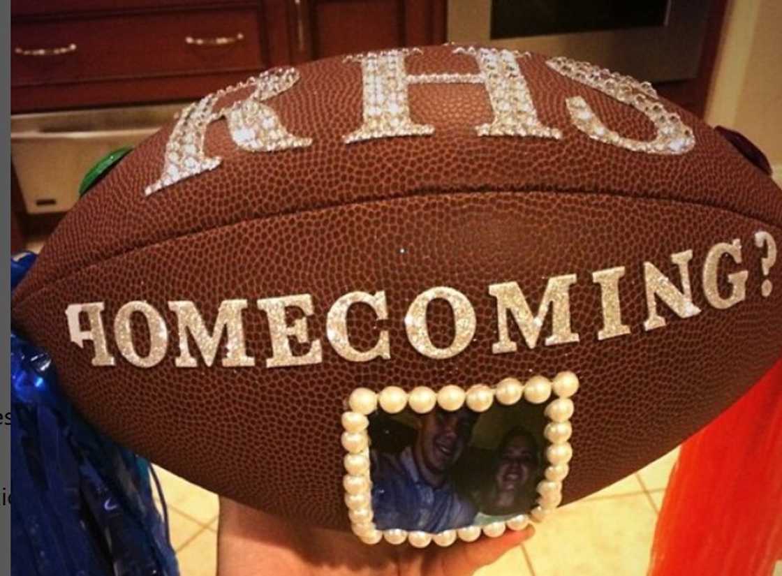 A football customised for Homecoming with a couple's photo