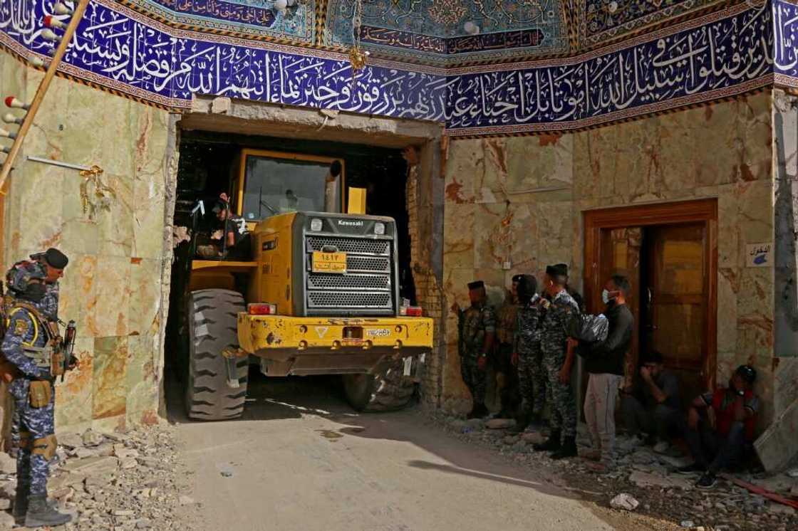 Iraqi rescue workers searched for two days for pilgrims trapped under the rubble of the Qattarat al-Imam Ali shrine following a landslide, on the outskirts of the holy city of Karbala