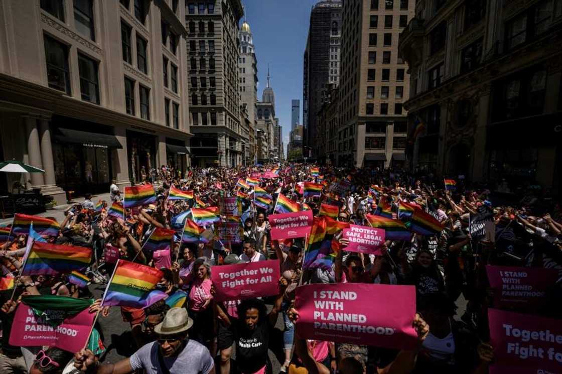 Participants marched through lower Manhattan in the blazing sunshine during the march, the first time it has been held since the pandemic began Participants marched through lower Manhattan in the blazing sunshine during the march, the first time it has been held since the pandemic began