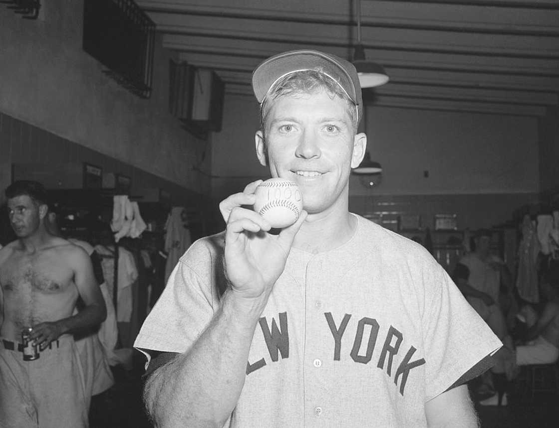 Mickey Mantle holds a baseball Mickey Mantle holds a baseball