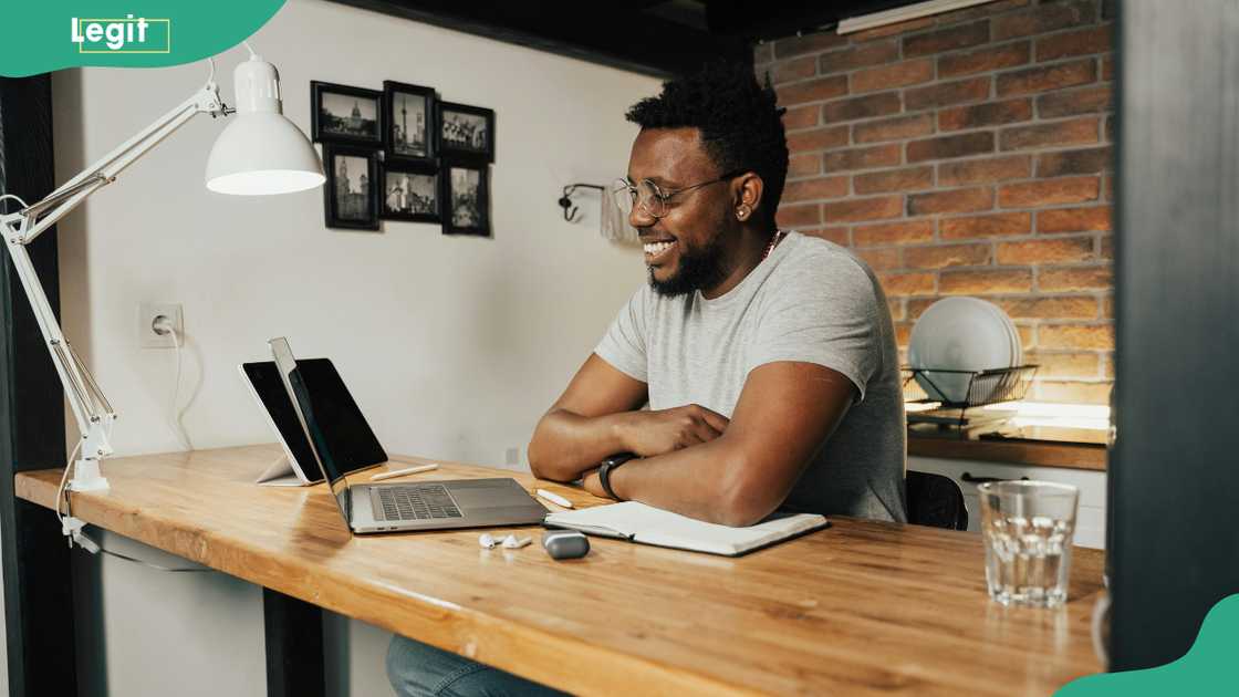 A man working on a laptop at an office