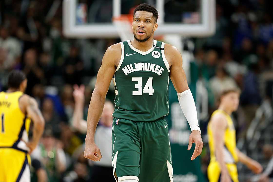 Giannis Antetokounmpo walks off the court during a match Giannis Antetokounmpo walks off the court during a match